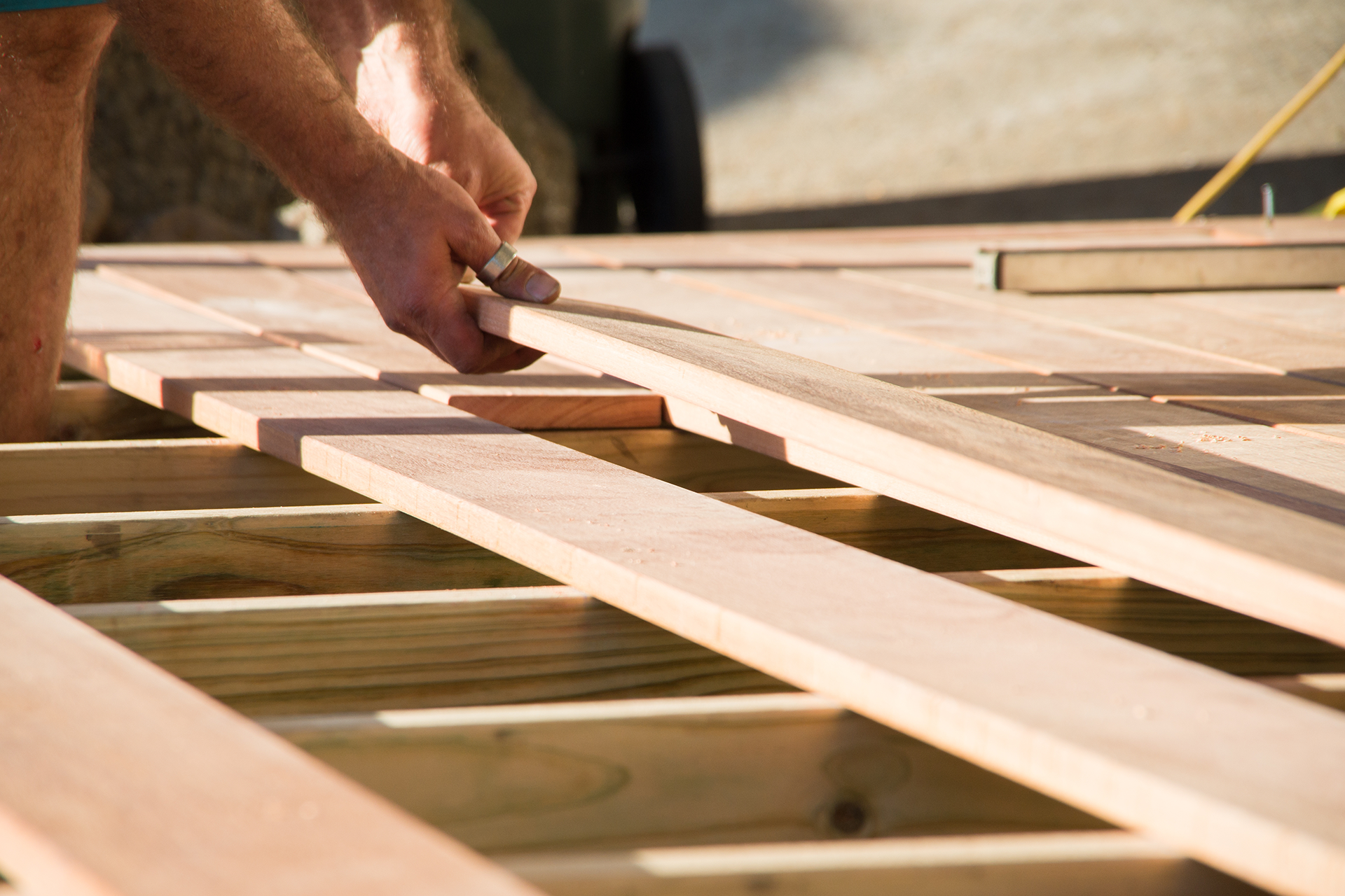 Composite deck surface close-up with hidden fasteners and clean board lines