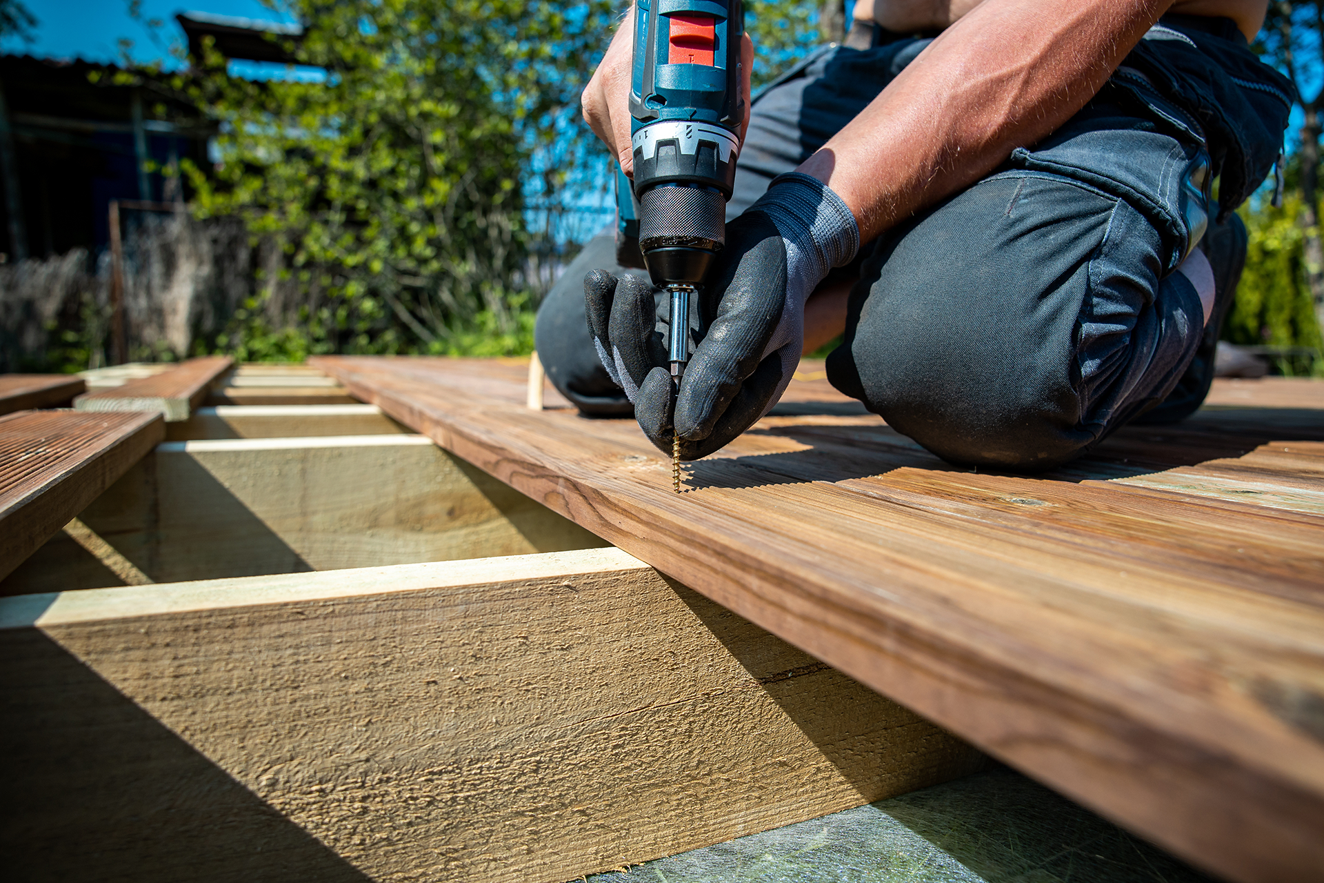 Multi-level deck framing and flashing details during construction